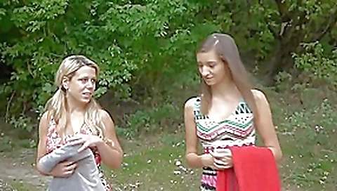 Two girlfriends walking in forest and meeting a guy Two girlfriends walking in forest and meeting a guy