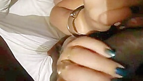 Women rubbing two cocks together